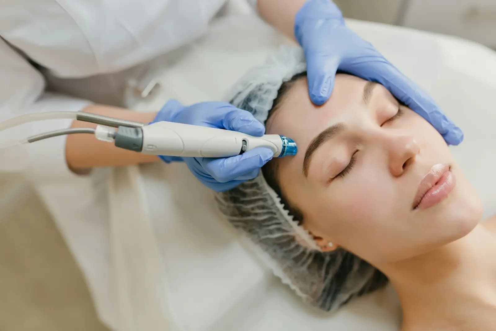 Hydrating facial with a suction handpiece on the forehead
